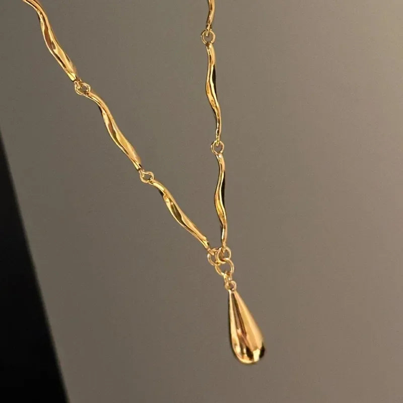 The Liquid Drop Tassel Necklace – Vintage Glossy Irregular Collar Chain.