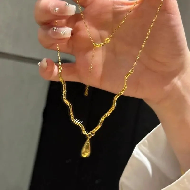 The Liquid Drop Tassel Necklace – Vintage Glossy Irregular Collar Chain.